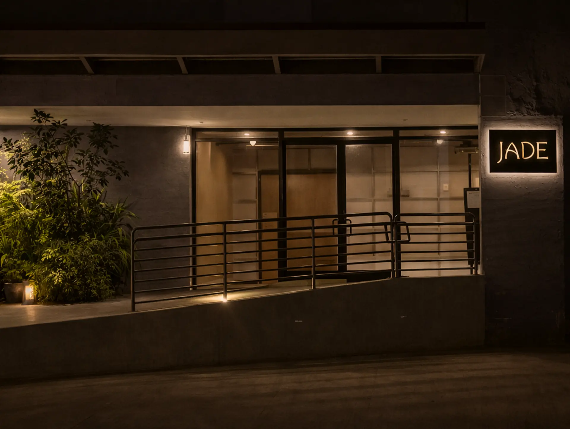 The discreet JADE entrance at night in Los Angeles